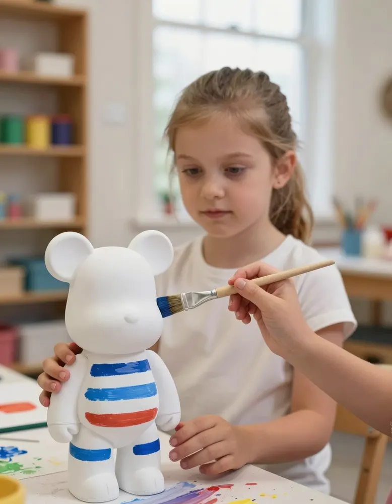 A girl painting bold stripes on a ceramic bear